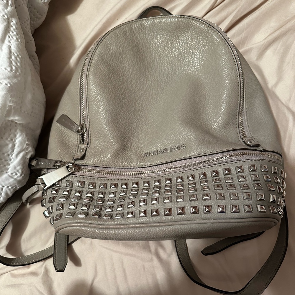Michael Kors grey studded backpack.
